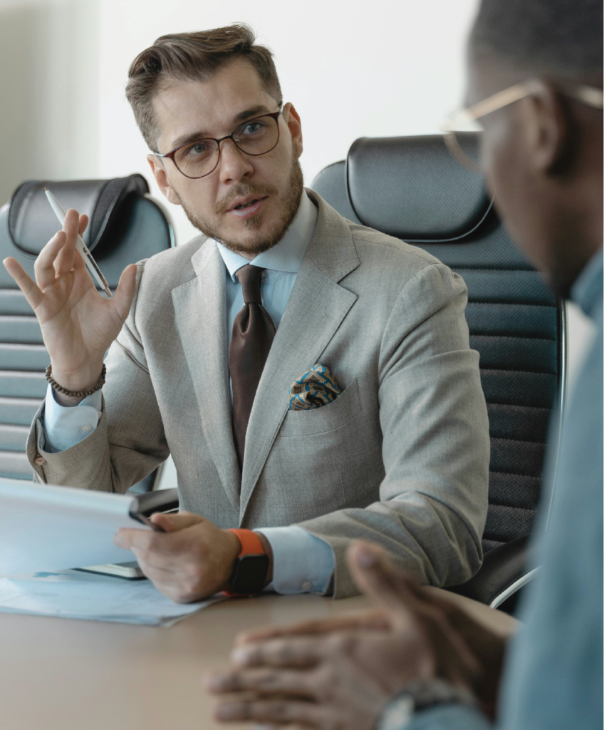 Meeting between note buyer and client discussing commercial note purchase and investment strategy